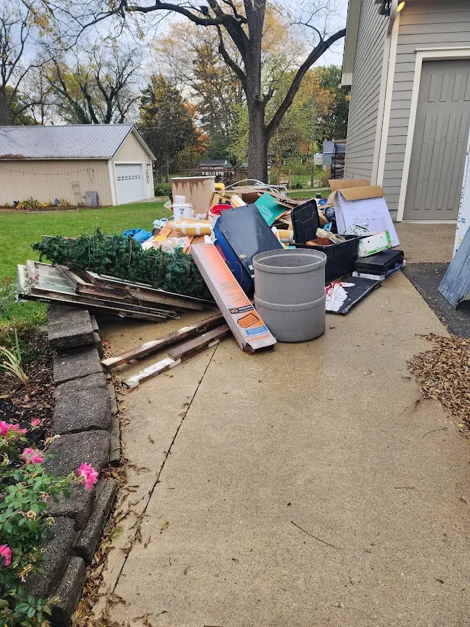 Dumpster being loaded with debris for 30 Yard Dumpster Rental in Berwick
